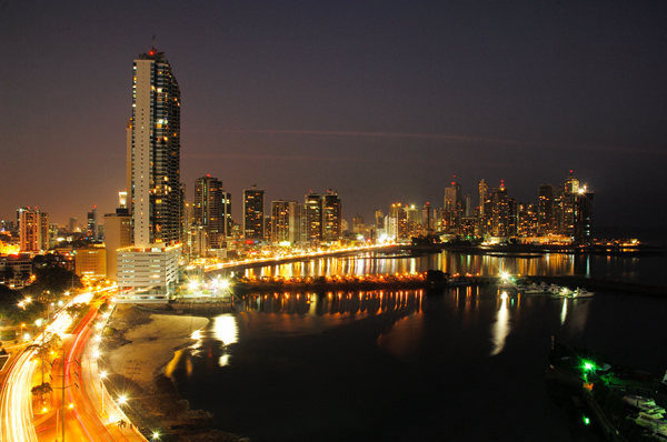 Panama City coastal road at dusk, showing the Intercontinental Miramar Hotel tower at left, Panama Photo