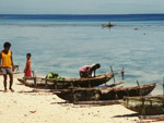 Boats on the beach, Alcester island, Trobiriand Islands, Papua New Guinea photo