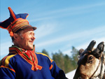 A Sami and a reinder, Lapland, Sweden photo