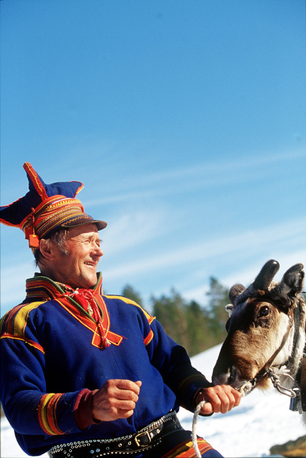 A Sami and a reinder, Lapland, Sweden Photo