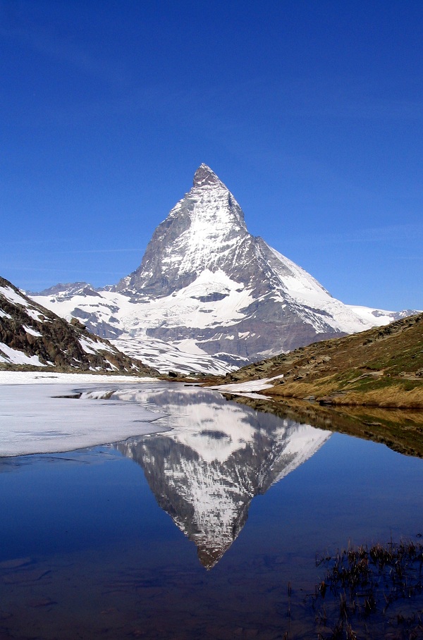 Matterhorn, reflected in lake, Riffelsee, Switzerland photo.