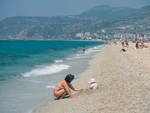 Beach, with the city and its resort hotels in the distance, Antalya, Turkey photo